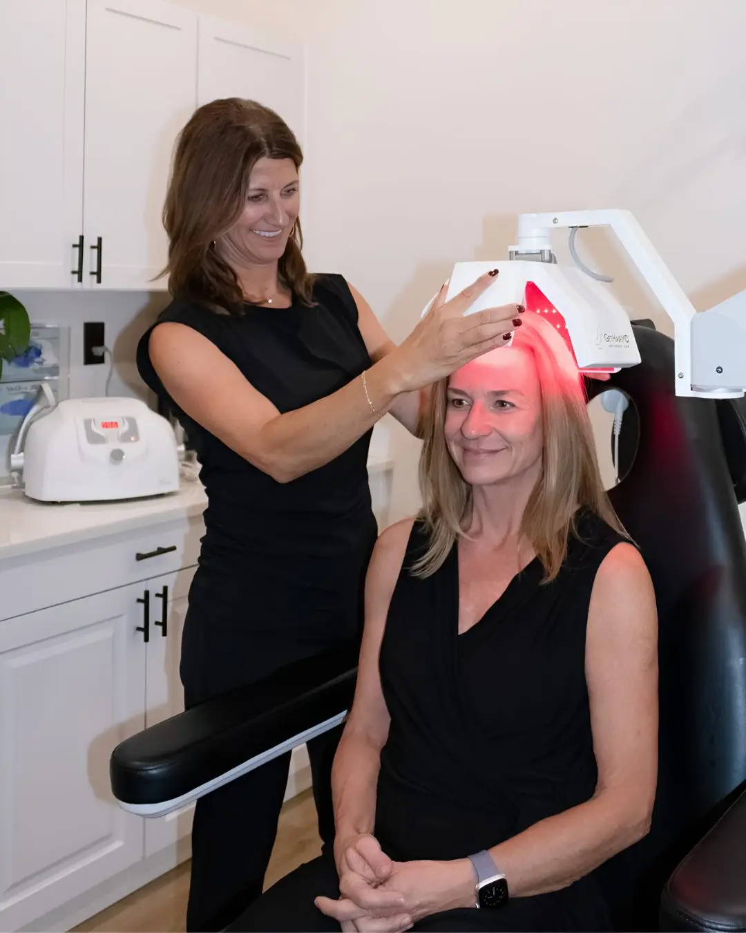 Woman receiving low-level laser hair therapy for female pattern hair loss in Dayton, Ohio